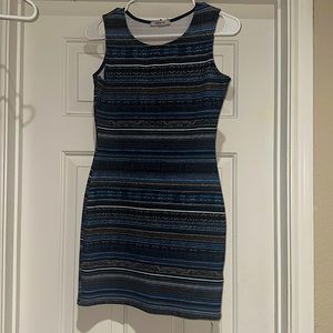 Blue dress w tan accents. Very flattering on the body. Has only been worn 2x.